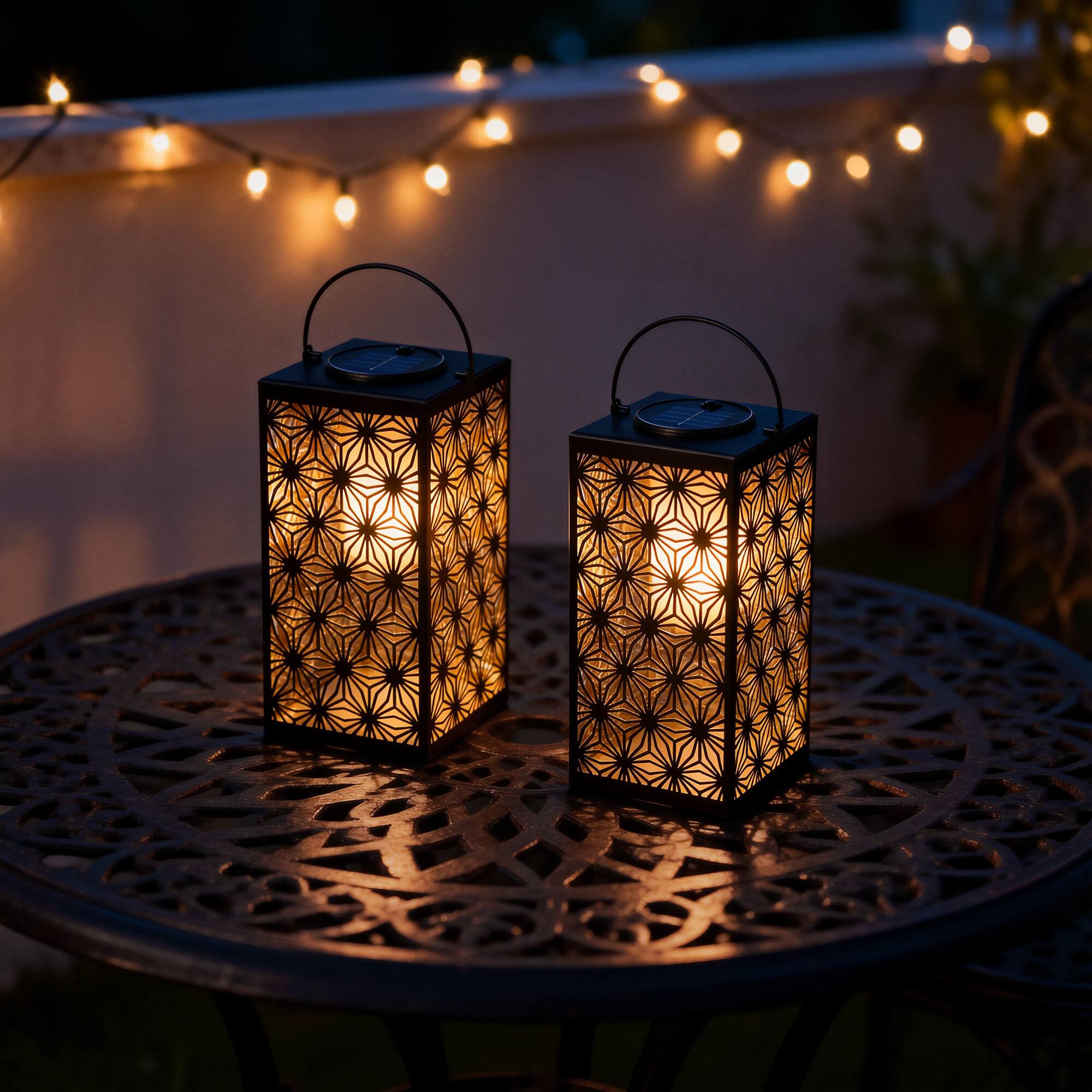 Glitzhome® 11" Set of 2 LED Black Metal Cutout Pattern Solar Powered Hanging Lantern